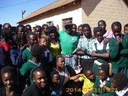 MOPH 016 The girls pose for a photo with one of the residents